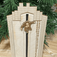 Load image into Gallery viewer, Die Hard Advent Calendar - Hans Gruber Falling off off Nakatomi Plaza